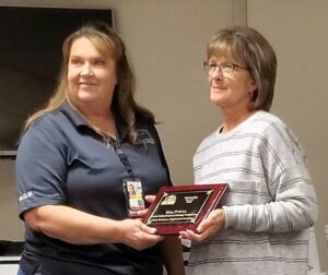 image of Lisa Peters receiving Outstanding Service Award for 2022 from Kansas Emergency Management Association